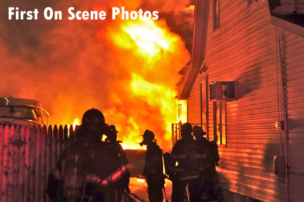 Firefighters respond to a garage fire in West Hempstead, New York.