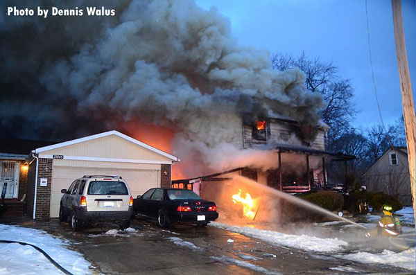 Firefighters attack a raging house fire in Royal Oak, Michigan.