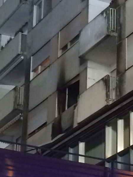 Damage visible on the apartment's exterior.