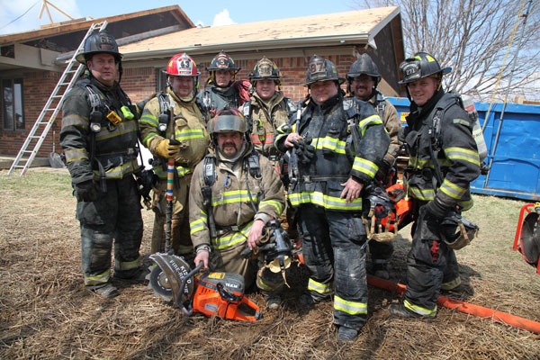 A group of firefighters on the training ground.