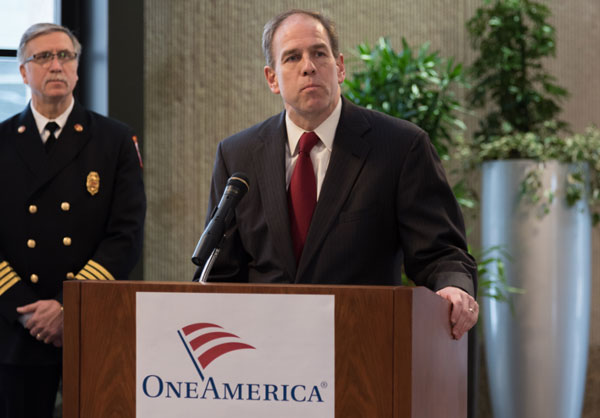 OneAmerica CEO Scott Davison (at podium) introduced Gerald George, Assistant Chief of the Washington Township/Avon (Indiana) Fire Department, speaks at a ceremony at OneAmerica Tower.