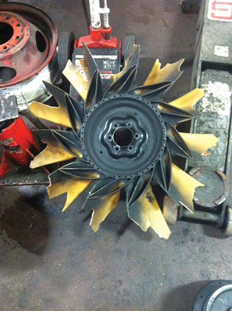 (12) This engine cooling fan obviously came in contact with an immovable object!