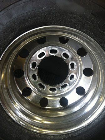 (7) Elongated bolt holes in this wheel were caused by improperly torqued lug nuts.