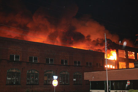 (1) Within minutes, the fire quickly spread from the loading dock into the complex. <i>(Photos courtesy of Terry Costigan, TMC News.) </i>