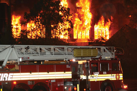 (3) The initial truck placement of Elyria’s ladder. The key lesson here is to anticipate where the fire is going to go before you set up, not where the fire is at the time. We had to position this unit several times in the beginning stages. Don’t be in a rush to set up your big guns. Give the fire’s progression some thought. Knowledge of building construction types and fire spread is the key!