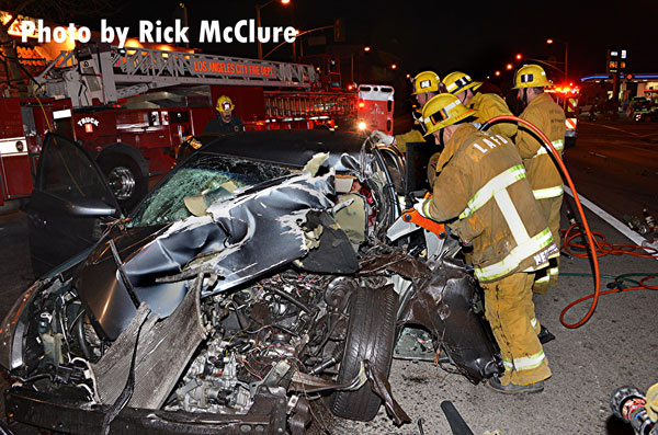 City of Los Angeles (CA) firefighters perform extrication operations at the scene of a collision.