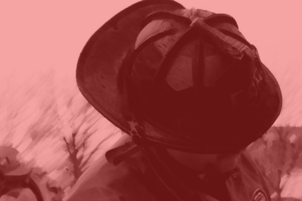 A firefighter and fire helmet.