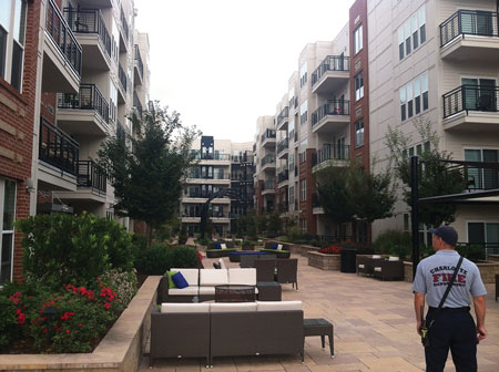 (1) This large residential complex has limited access to the courtyard, which will hamper getting portable ladders into position to the upper floors. (Photo by Scott Hardin.)