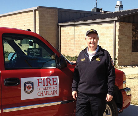 (5) The LFD has provided Chaplain Kenneth Wells with magnetic signs to assist in making his personal vehicle more easily identifiable at emergency scenes. (Photo by Sheri Baldwin.)