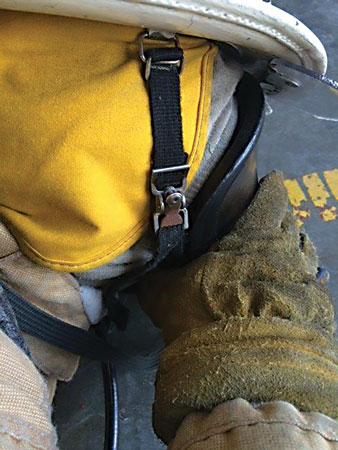 <b>(6, 7) </b>The mask sucks the firefighter’s face, and he immediately drops to the floor and places the mask as close to the ground as possible. He must crack the seal of the mask under his chin just enough to let some air in and then replace it as he exhales. Using the neck strap of the coat, he should tuck his face down to stay as covered as possible. He can perform this several times until he finds a place of refuge.