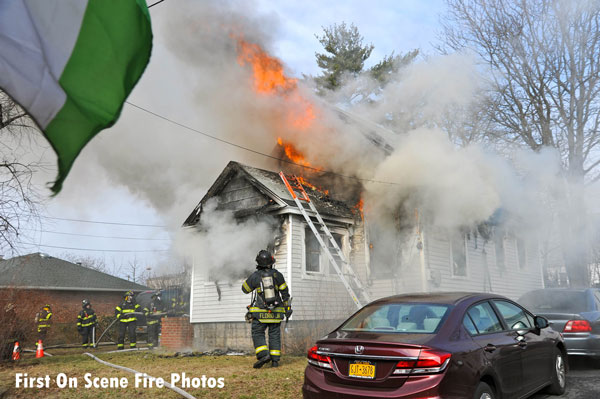 Firefighters at the scene of a raging fire on Long Island.