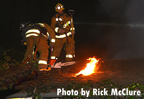 Firefighters operate on the roof at a garage fire in Los Angeles, California.