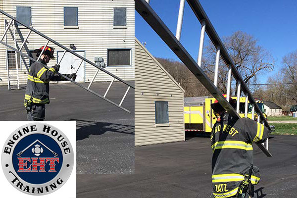 Firefighters carrying ladders on the training ground.