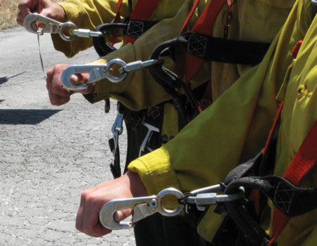 (3) Three different equipment rigging setups. The top setup is rigged correctly using a Kong clip. The middle setup is rigged correctly using an O-ring. The bottom setup is rigged incorrectly using an O-ring.