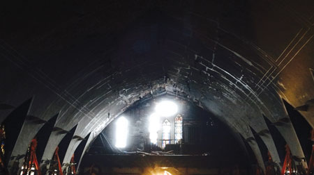 (3) A view of the choir loft. The organ and pipes are often below the rose window, with the organ pipes rising and obstructing part of the window. This was the location of the organ at Our Lady of Sorrows, but the pipes had collapsed prior to the fire department’s arrival, thereby providing unobstructed access through this window.