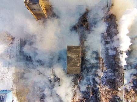 (1) The drone flying over the structure gives an incident commander (IC) a bird’s-eye view of the structure and all interior walls, which allows him to assess the building area’s stability that is not visible from the street. <i>(Photos by Trevor Hogan.) </i>“></td></tr><tr><td>(1) The drone flying over the structure gives an incident commander (IC) a bird’s-eye view of the structure and all interior walls, which allows him to assess the building area’s stability that is not visible from the street. <i>(Photos by Trevor Hogan.)</i></td></tr></tbody></table></figure>



<p>Recently (and often), drones [also known as unmanned aerospace vehicles (UAVs)] and the fire service have been in the news together. For instance, the presence of drones in wildfire fighting aircraft airspace has grounded all aircraft fighting the fire until the drone has vacated the area, and one video has surfaced showing a nozzle firefighter trying to knock down a drone with a hose stream.</p>



<p>Like it or not, drones are here to stay, and the fire service must be out in front on the issue, or we will be left behind. Much of this deals with educating the public and working with local, state, and the federal government to understand the current laws and then getting those laws in place to deal with the issues that drones pose.</p>


<table width=