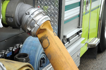 (1) An LDH supply line connected directly to a hydrant collapses at the pump intake because of insufficient pressure. <i>(Photos, except photo 21, by Eric Goodman.) </i>