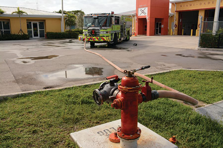 (9) This engine is supplied by three-inch hose. The four-way valve is connected to the hydrant and used as a gate valve in case a steamer connection is later necessary.