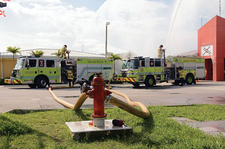 (11) A four-way valve improvised as a wye is supplying two engines by flowing their deck guns. Both engines are flowing 600 gpm from 1½-inch smooth bore tips.