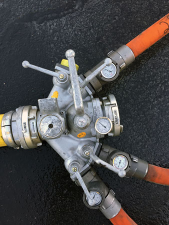 ((21) Three 2½-inch hoselines are connected to this manifold with inline gauges, which are carried by the Clark County (NV) Fire Department. <i>[Photo courtesy of the Clark County (NV) Fire Department.]</i> 