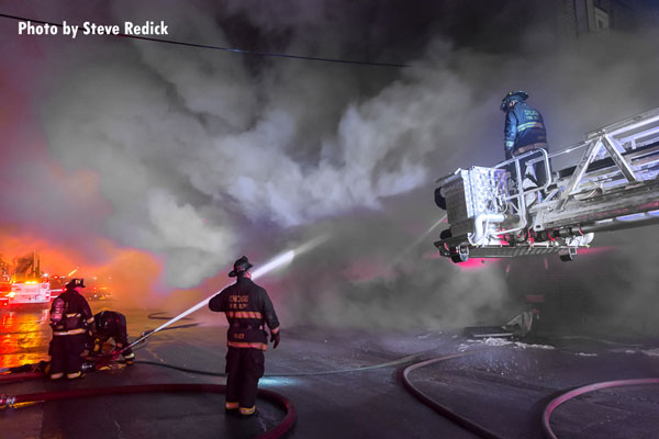 Chicago firefighters operating at the scene of a 3-11 alarm.