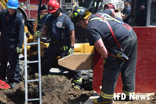 Firefighters at the scene of a trench rescue in Indianapolis.