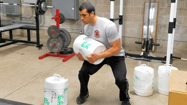 Jordan Ponder performing firefighter physical fitness training