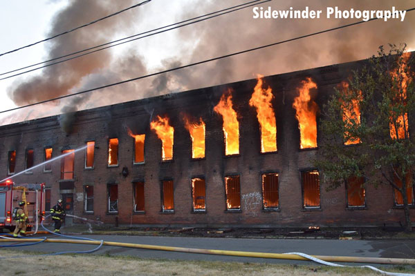 Flames erupt from a warehouse in Watervliet, New York.