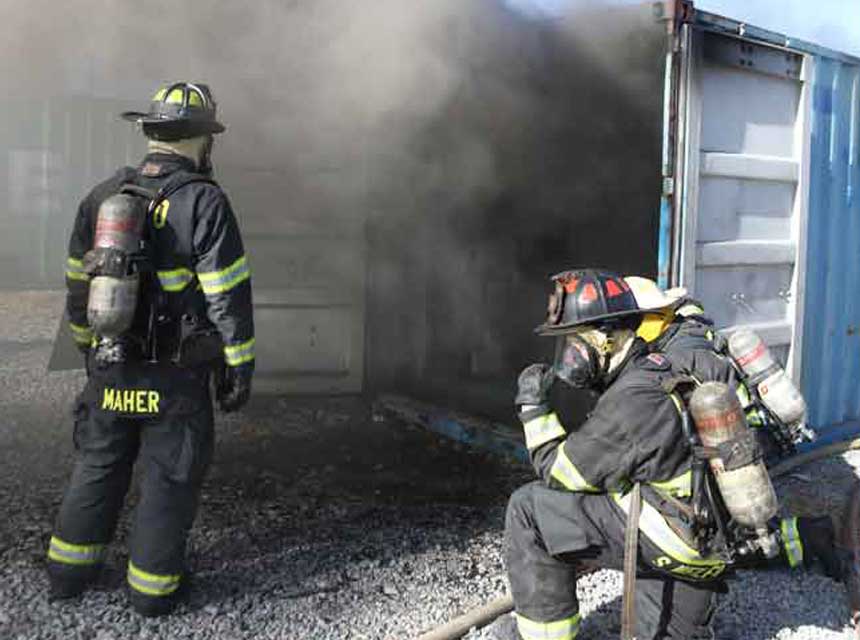 Firefighters work at a flashover container at FDIC Internatiional 2019