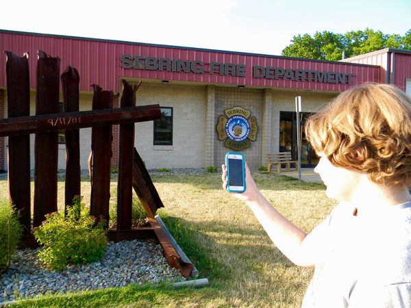 A teen plays Pokemon Go outside the Sebring Fire Department.