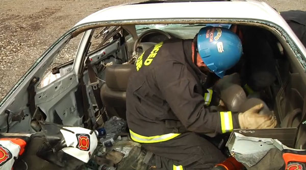 Removing the front seat to access the patient.