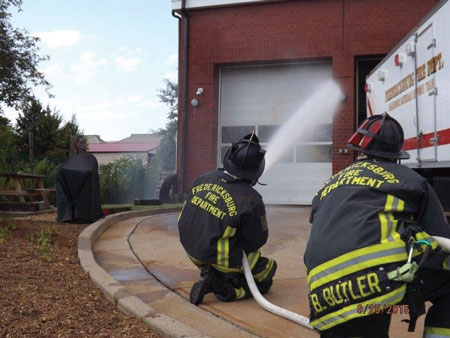 (3) Personnel apply water with a fog nozzle set to a narrow fog for 10 seconds and move the nozzle in a smooth, controlled motion. This is being pumped through a 200-foot, 1½-inch attack line with a 125-gpm, 75-psi fog nozzle.