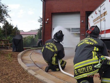 (6) Personnel apply water with a fog nozzle set to a narrow fog for 10 seconds and move the nozzle in a smooth, controlled motion. This is being pumped through a 200-foot, 1½-inch attack line with a 125-gpm, 75-psi fog nozzle.