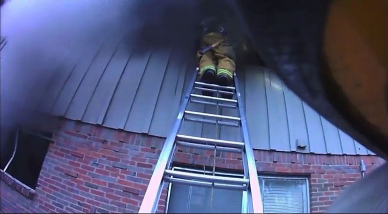 Firefighters performing a VES operation.