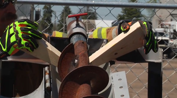 Firefighters use chocks to stabilize the auger.