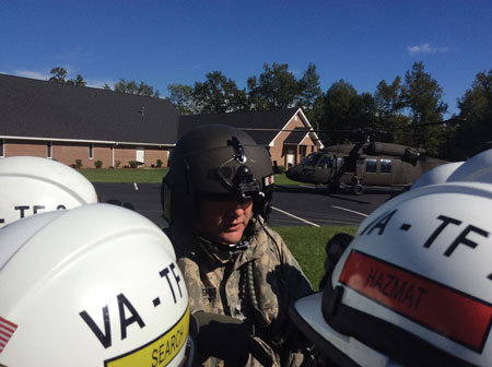 (2) VA-TF2 is briefed prior to loading a Blackhawk helicopter to fly to Williamsburg County, South Carolina. 