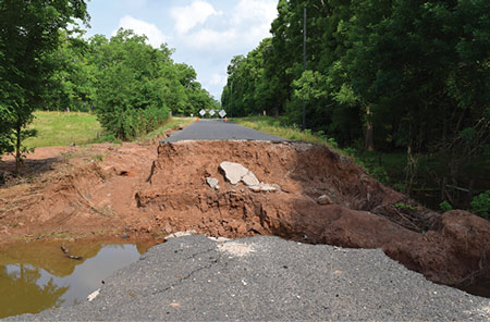 <b>2) </b>A collapsed bridge in Waller County, Texas. Raging creek water rose to 18 feet, damaging many roads and bridges.