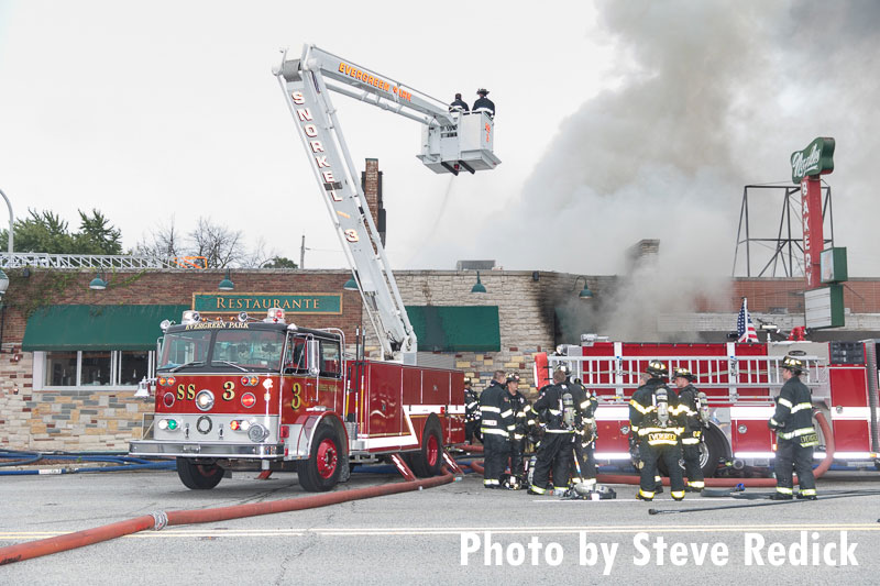 Fire apparatus positioned outside a burning restaurant in Evergreen Park, Illinois.