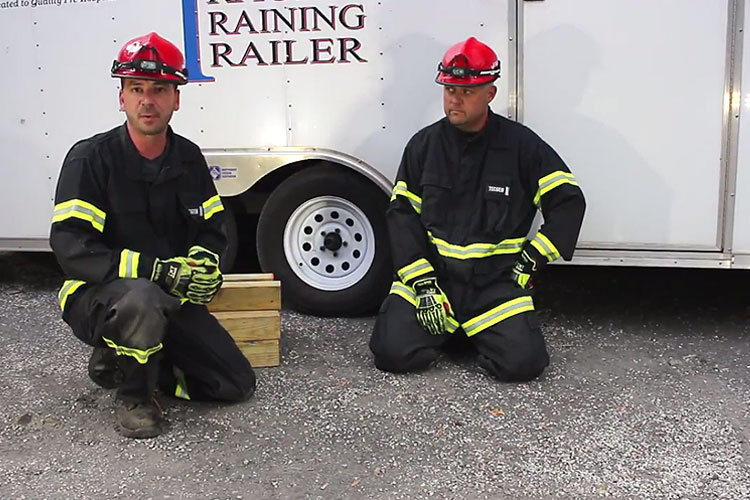 Brock Archer and Instructor Fletcher discuss basic box cribbing for vehicle rescue.