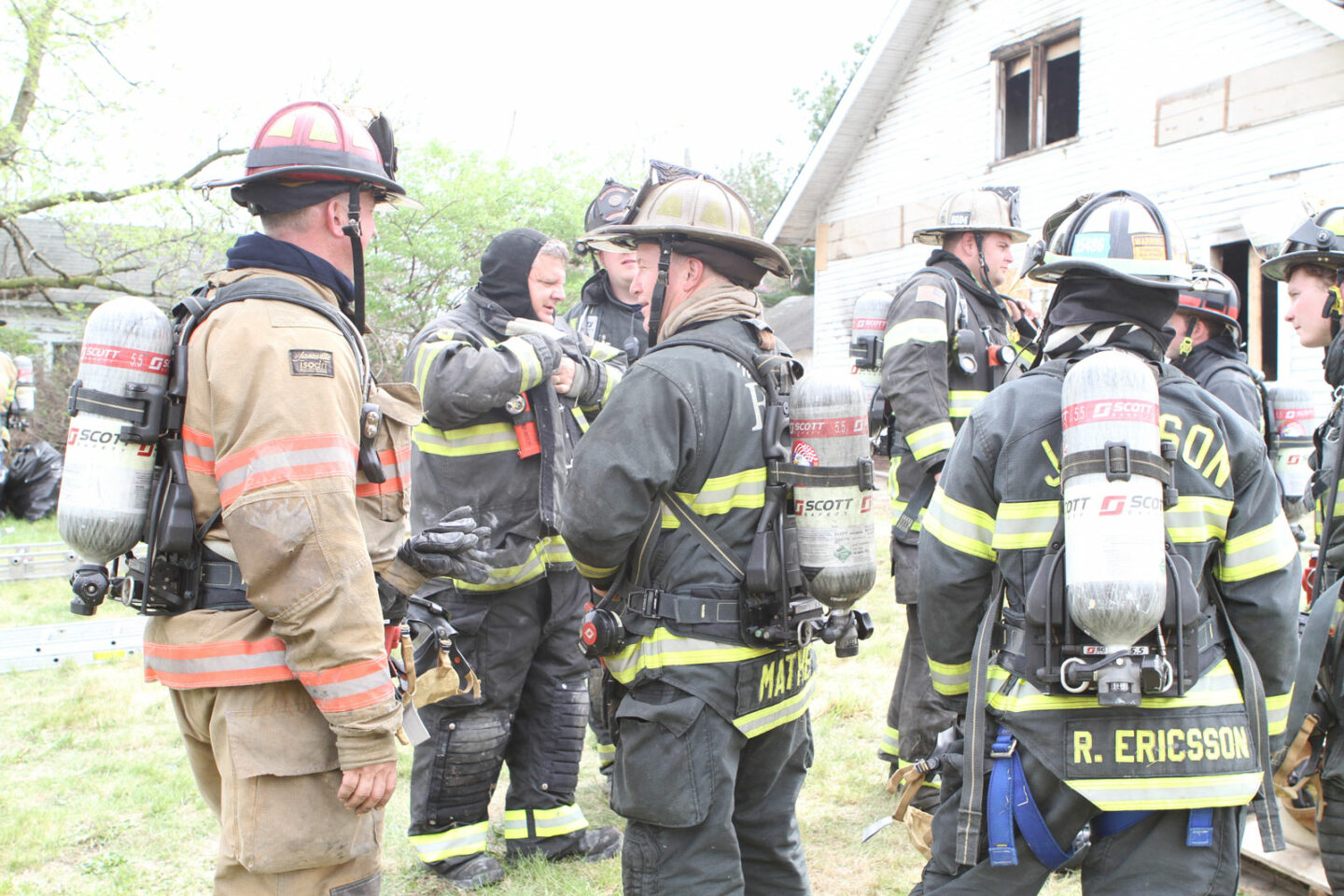 Firefighters standing around during training