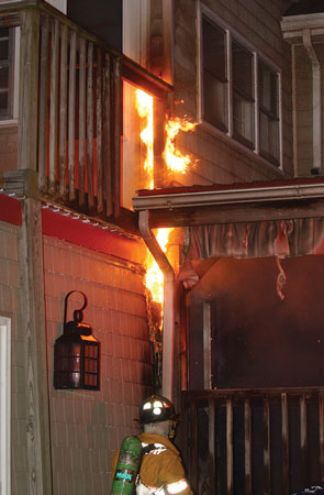 (6) An incipient exterior fire that will reach the eaves in seconds and then become an interior fire. <i>(Photos 6-8 by Todd Dudek.)</i>“></td>
</tr>
<tr>
<td align=