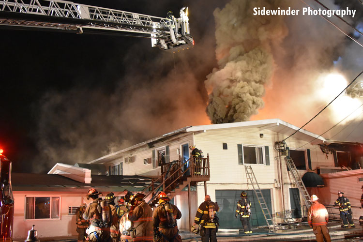 Firefighters at the scene of a fire in Latham, New York.