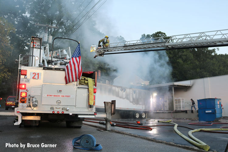 Chattanooga fire apparatus and firefighters at the scene of a trailer fire.