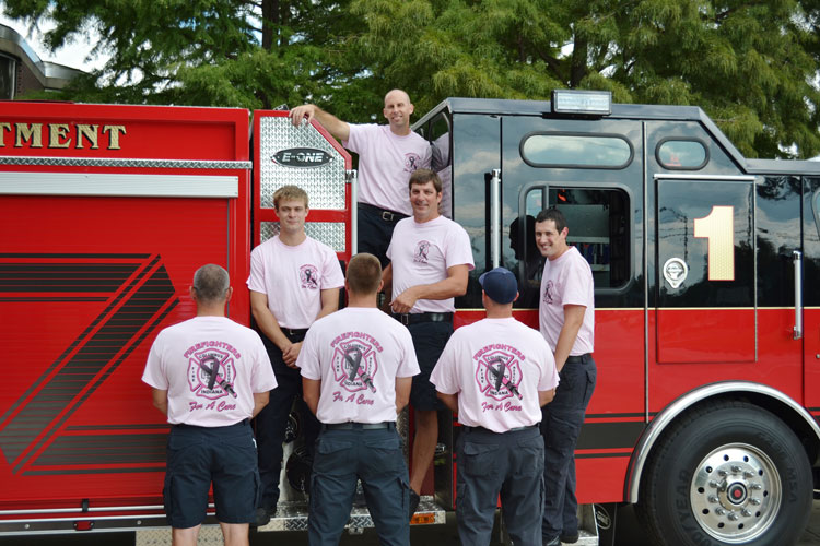 Another shot of Columbus firefighters wearing pink for breast cancer awareness month.