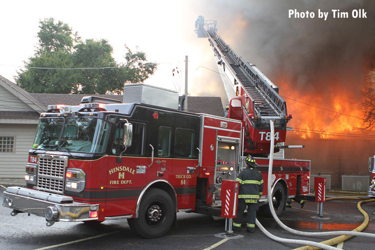 Fire apparatus at the scene of a major fire in a banquet hall.