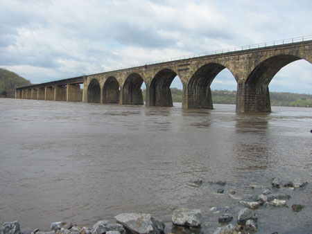 (1) Crude oil unit trains travel over the rail bridge spanning the Susquehanna River from York County (background) to Lancaster County (foreground). (Photos by author.) 