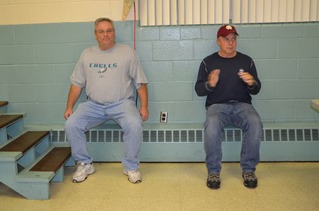 (2) LFC President and former Chief Tom Walters (left) and LFC Chief Ken Shuler perform the wall sit.