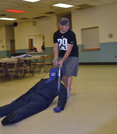 (4) LFC Firefighter Rickey Shuler at the rescue dummy drag station.