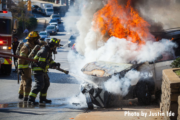 Asheville firefighters extinguish a vehicle fire.