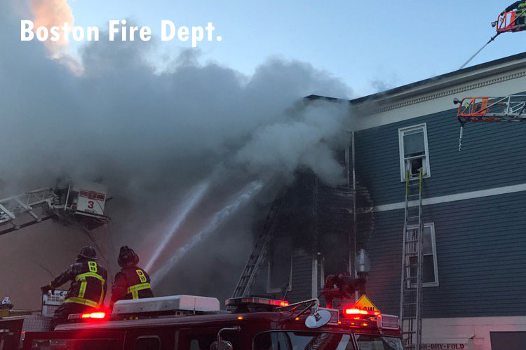 Boston firefighters operate in frigid temperatures at the scene of a Charlestown structure fire.